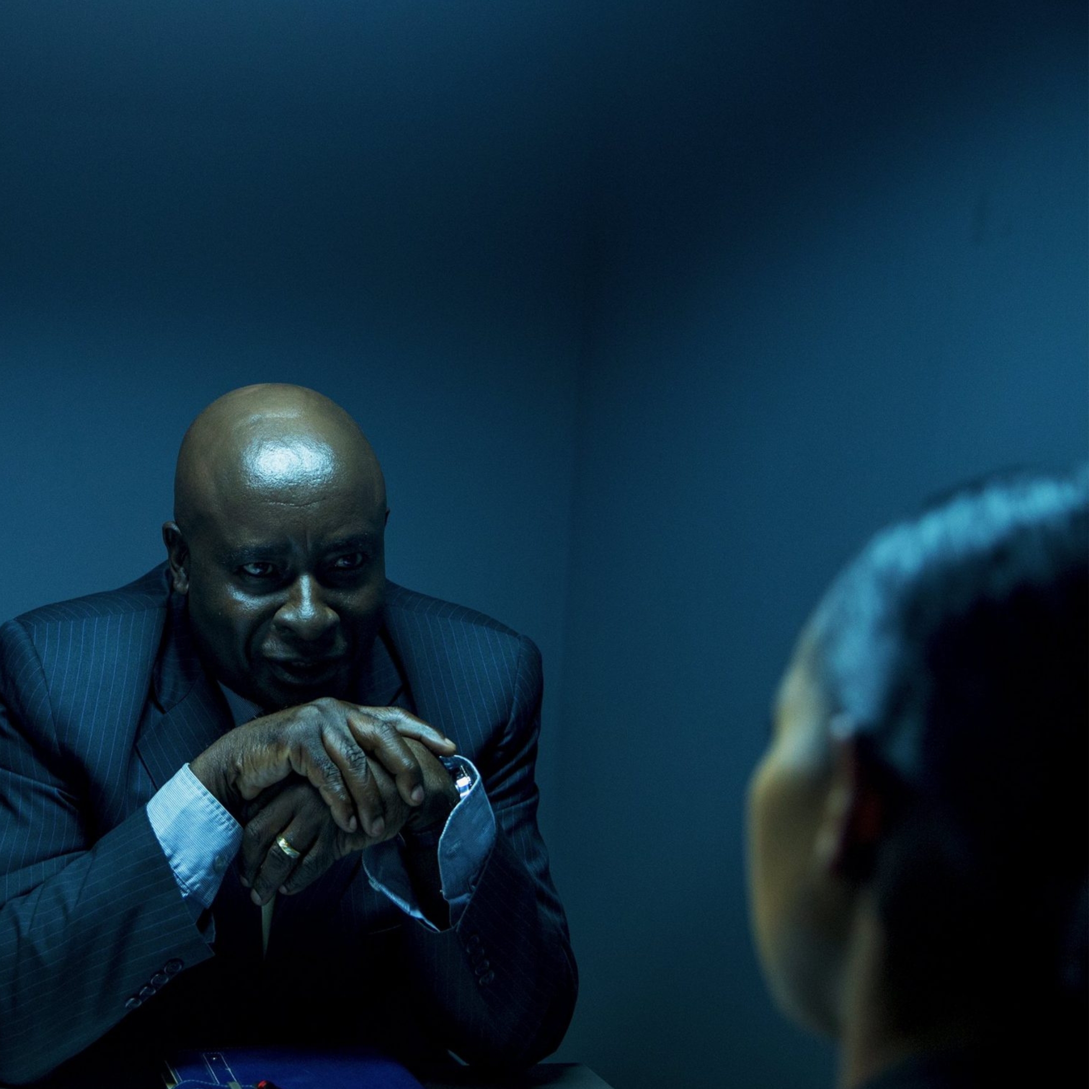 Two people in an interrogation room, a common thing in Nollywood crime films