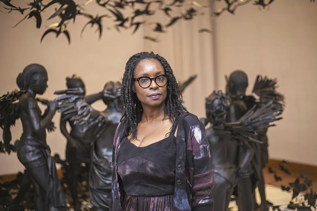 Peju Alatise with one of her sculptures, Flying Girls